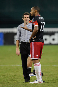 Olsen talks with Thierry Henry of the New York Red Bulls, the team DC United will face in the Eastern Conference semifinals. (Getty Images/Patrick McDermott)