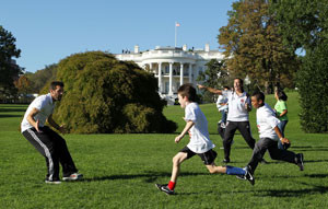 Olsen plays with kids on the South Lawn of the White House lawn as part of a youth clinic in 2010. (Getty Images/Alex Wong)