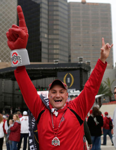 An Ohio State fan cheers before the Sugar Bowl NCAA college football playoff semifinal game between Alabama and Ohio State, Thursday, Jan. 1, 2015, in New Orleans. (AP Photo/Brynn Anderson)