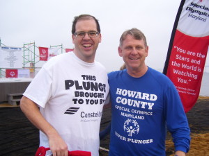 Adam Hays, Maryland Special Olympics athlete, and  Howard County Executive Allan Kittleman pose during the Super Plunge event on Jan. 24, 2015. (WTOP/Kathy Stewart)