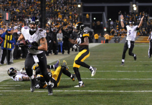 Baltimore Ravens tight end Crockett Gillmore (80) heads for the end zone ad a touchdown in the fourth quarter of an NFL wildcard playoff football game against the Pittsburgh Steelers, Saturday, Jan. 3, 2015, in Pittsburgh. (AP Photo/Don Wright)