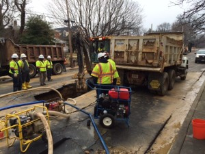 Crews are at the scene of the water main break in Falls Church. (WTOP/Robert Stallworth)