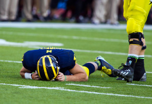 Michigan coaches and the athletic department came under fire for leaving their concussed quarterback, Shane Morris, in a game last season. (AP Photo/Tony Ding)