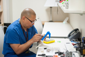 When Dr. Albert Chi's wife gave him a 3-D printer as a gift, he went online, found free designs and started printing prosthetic hands. (Courtesy Jen Own/e-NABLE)