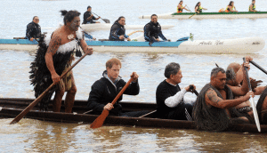 Britain's Prince Harry, second from left, front, helps to paddle a Maori waka (canoe) down the Whanganui River in Wanganui, New Zealand, Thursday, May 14, 2015. (Ross Setford/SNPA via AP)
