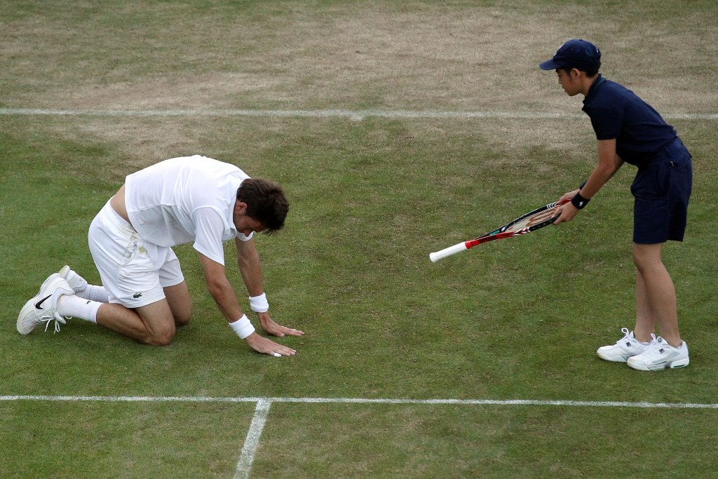 Mahut had to be handed his racket back at one point after diving for ball. (Photo by Oli Scarff/Getty Images)