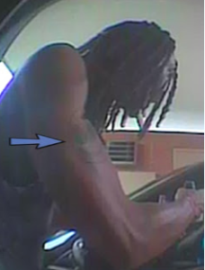 Police ask that you look at the "smiley face" tattoo on the suspect's right arm. (Courtesy Prince George's County Police)