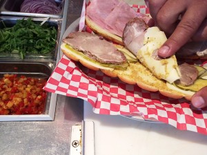 A Cuban Sandwich is made with ham, roasted pork, mustard, pickles and Swiss cheese. (WTOP/Rachel Nania) 