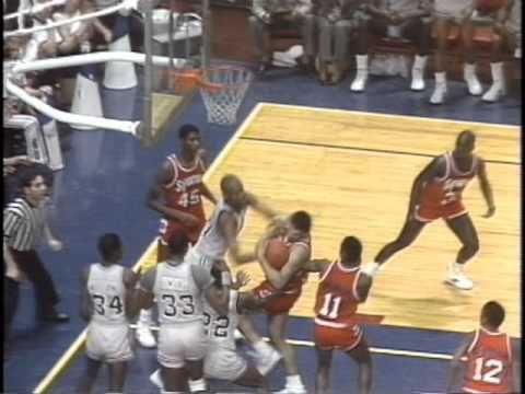 As Syracuse player Michael Graham and Andre Hawkins battle for a rebound, it appears as Hawkins throws a left-handed punch. Referee Dick Paparo at first appears to eject Graham, only to declare that it was just an intentional foul. (YouTube)