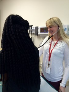 Megan Dieterich, a physician's assistant at Whitman Walker Health's Max Robinson Center, works with a patient. (Courtesy Whitman Walker Health)