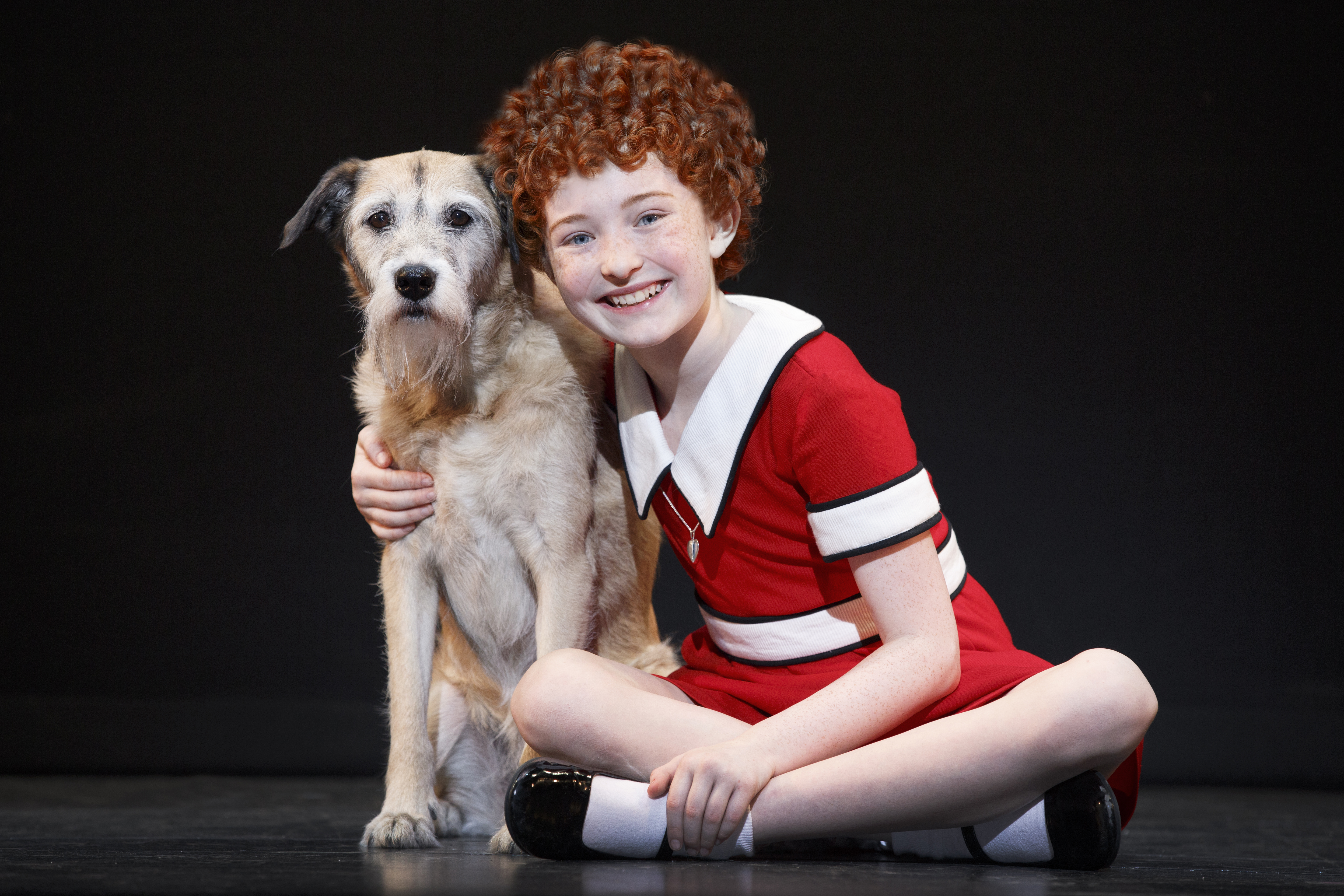 Actress Heidi Gray poses with Sandy in the national tour of "Annie." (Joan Marcus)
