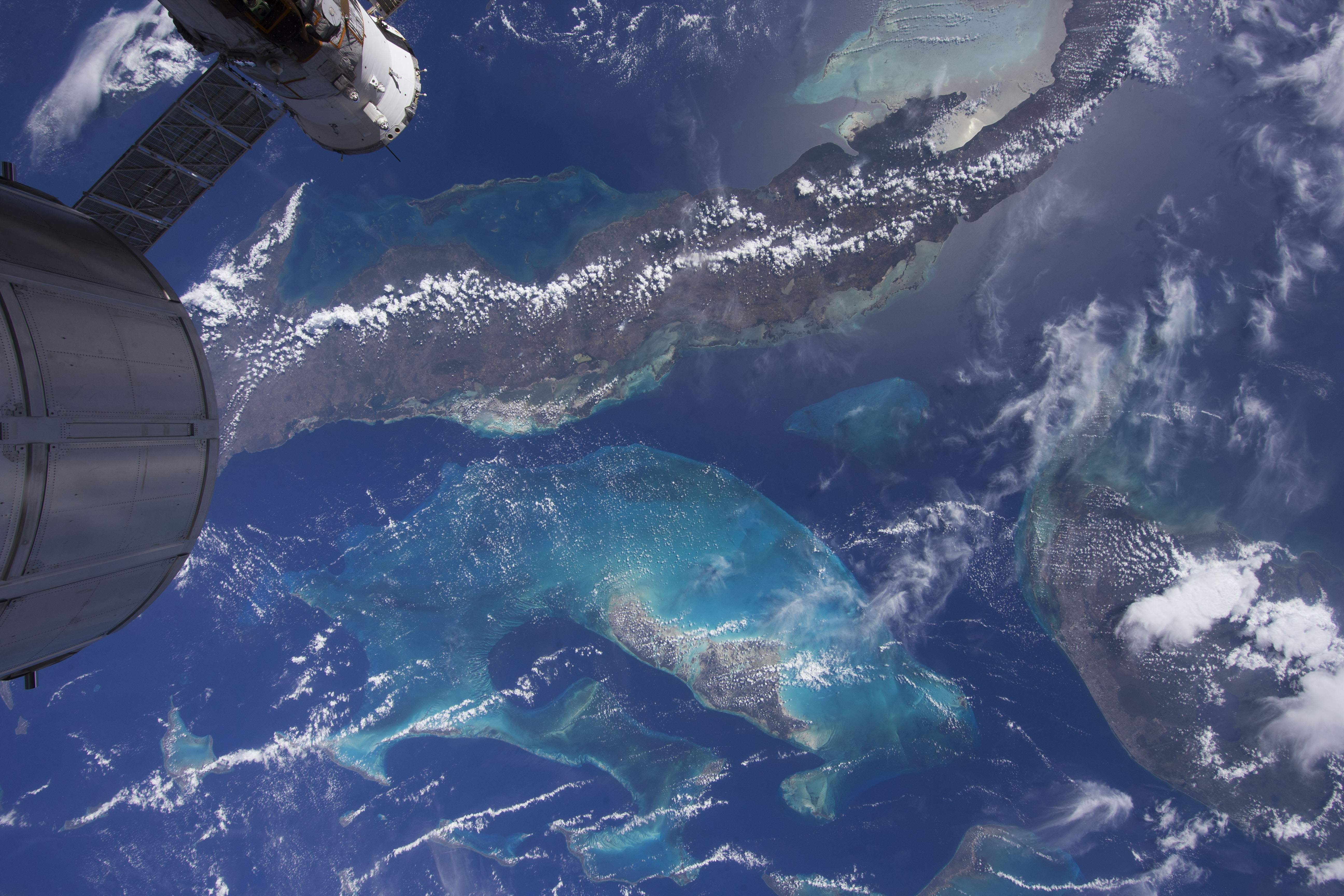 This shot from space shows the glowing Bahama Reefs on Earth in the new IMAX documentary "A Beautiful Planet." (IMAX)