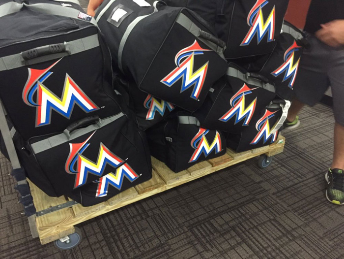 Player bags, with the parent club Miami Marlins logo, are one of a team's biggest hidden expenses. (Tim Grubbs)