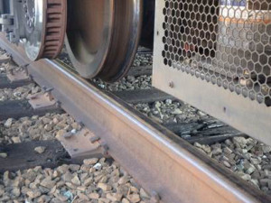 This photo depicts the location of a wheel in relation to the rail in the area of the wide gage of the WMATA July 29, 2016 derailment. (NTSB photo)