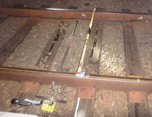 This photo depicts an area of deteriorated cross ties in the location of the WMATA July 29, 2016 derailment. The deteriorated condition allowed a tie plate to move laterally. (NTSB photo)