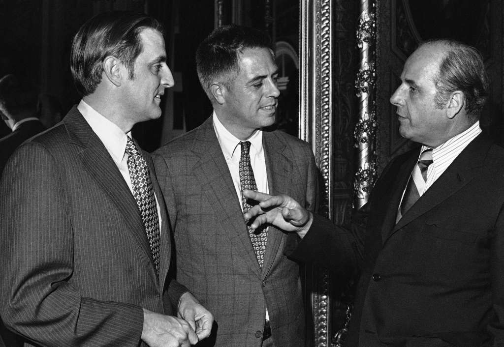Sen. Walter F. Mondale, D-Minn., left, chief sponsor of the $2.95 billion child care bill, and New York Conservative Sen. James L. Buckley listen at the Capitol to Sen. Gaylord Nelson, D-Wis., before the Senate voted on the proposal on June 20, 1972 in Washington. (AP Photo)