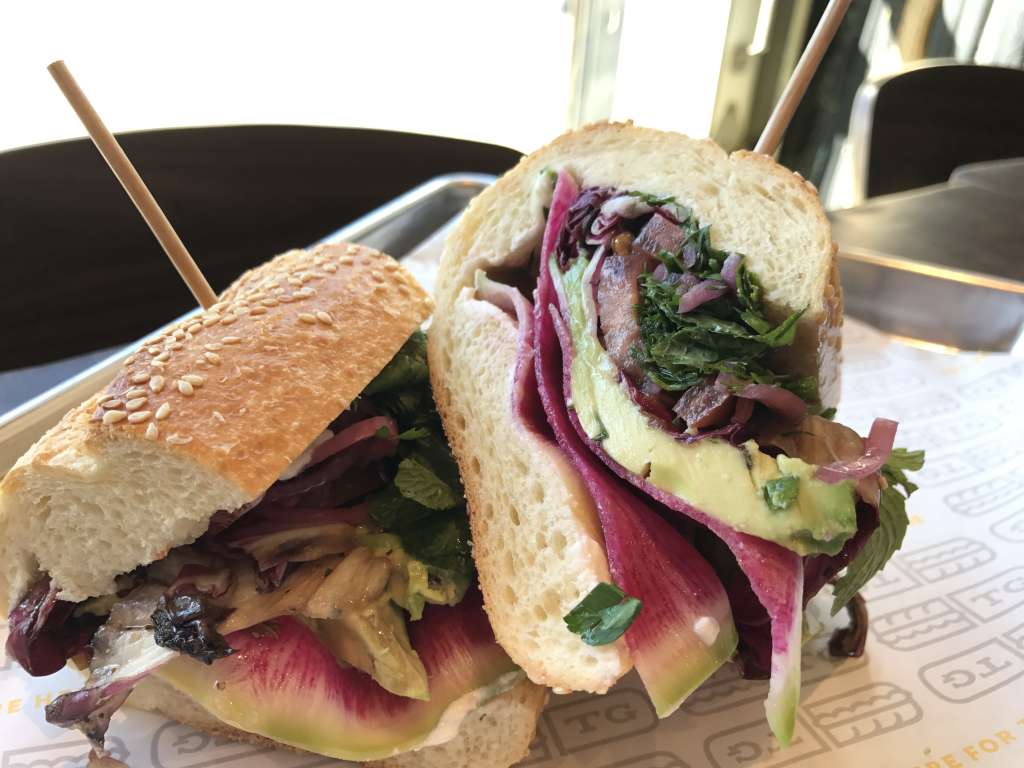 The Toast Redux is made with lemon ricotta, watermelon radish, sliced avocado, charred radicchio, herb salad, pickled red onion, tomato and olive oil. (WTOP/Rachel Nania) 