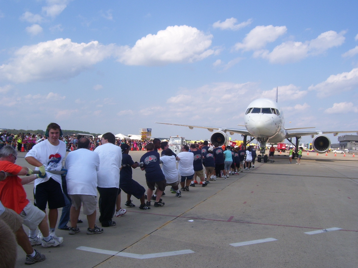 Special Olympic athletes pull 82-ton plane