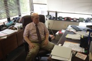 man sits in his office