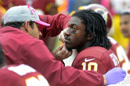 Hard-hit Ponder, RG3 meet as Vikings face Redskins