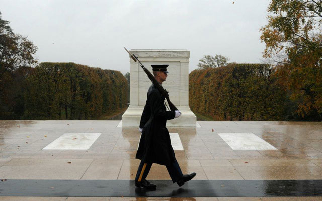Tomb of the Unknown sentinel stands in face of Sandy