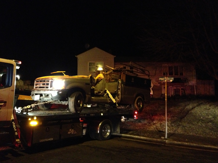Truck hits Woodbridge home, traps man in bed
