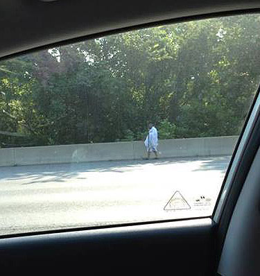 Man in toga greets Beltway commuters