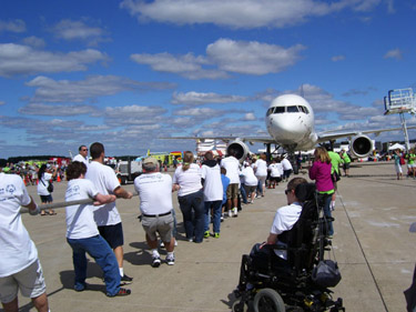 Athletes pull together for Special Olympics at Dulles Airport