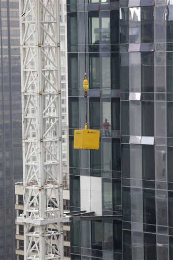 Concrete weight dangles from crane over NYC street