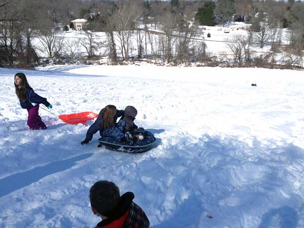 Local kids discuss the perfect sled-riding technique