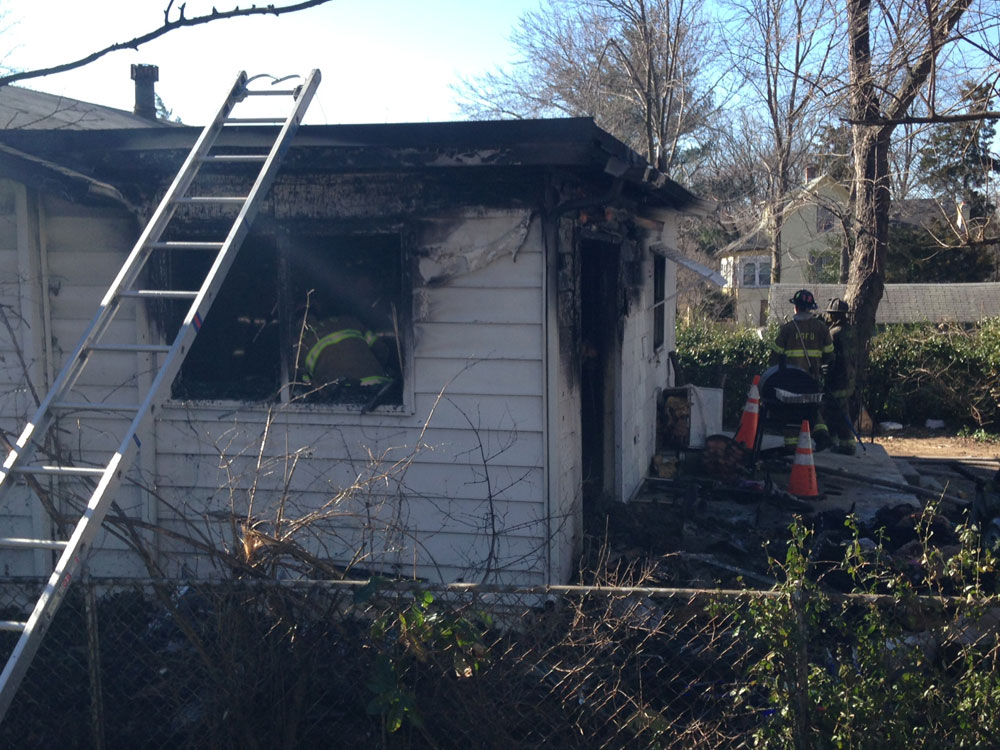 High winds push flames through house