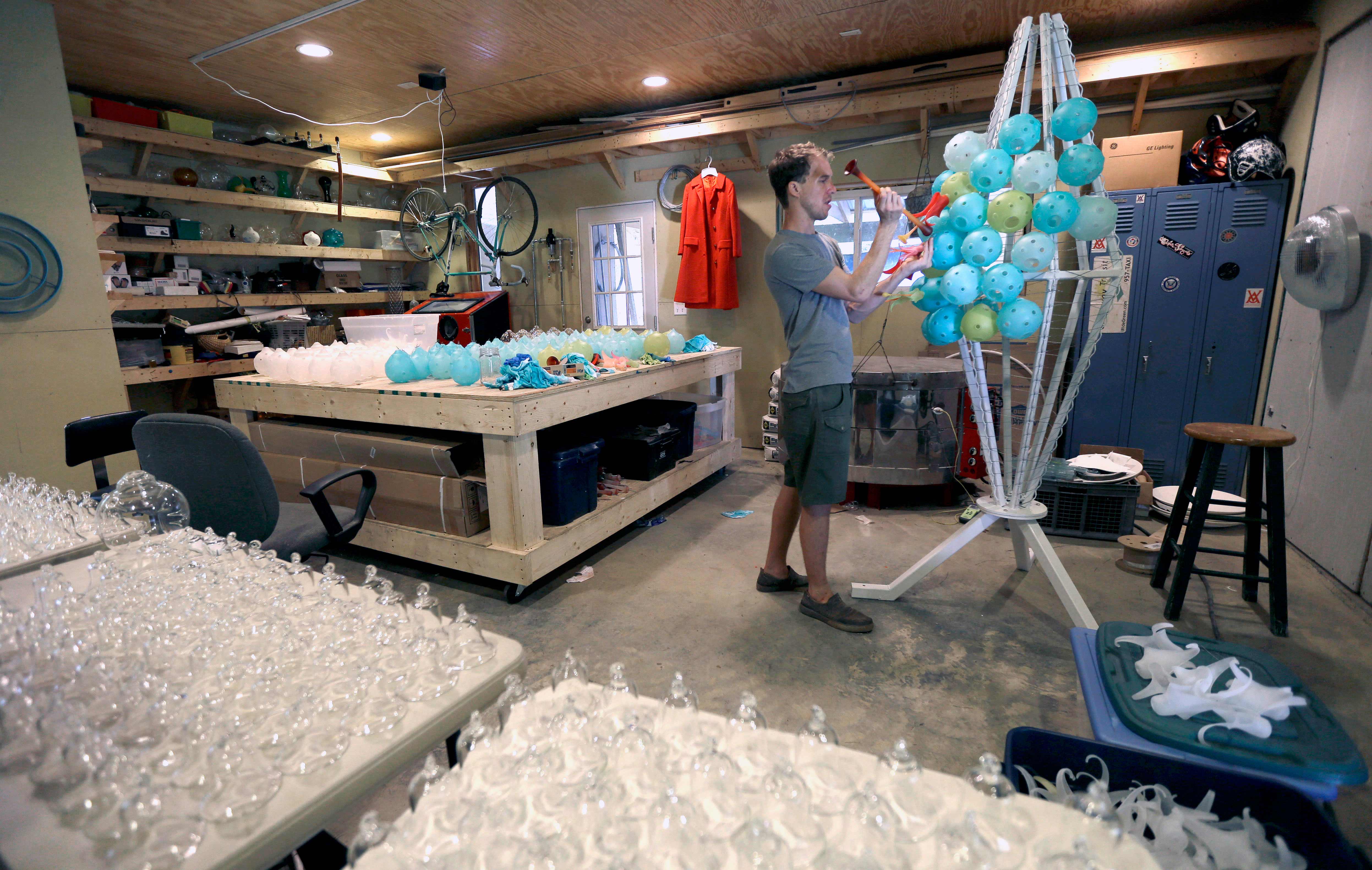 AP PHOTOS: NC artist burns glass into sculptures