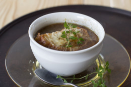 This Dec. 1, 2014 photo shows slow cooker onion soup in Concord, N.H. The humble onion is one the most common aromatic vegetables, popping up in so many ways across so many cuisines. (AP Photo/Matthew Mead)