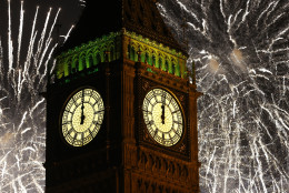 Fireworks explode over the clock known as 'Big Ben' housed in Elizabeth Tower, to celebrate the New Year in London, Thursday, Jan. 1, 2015. (AP Photo/Kirsty Wigglesworth)