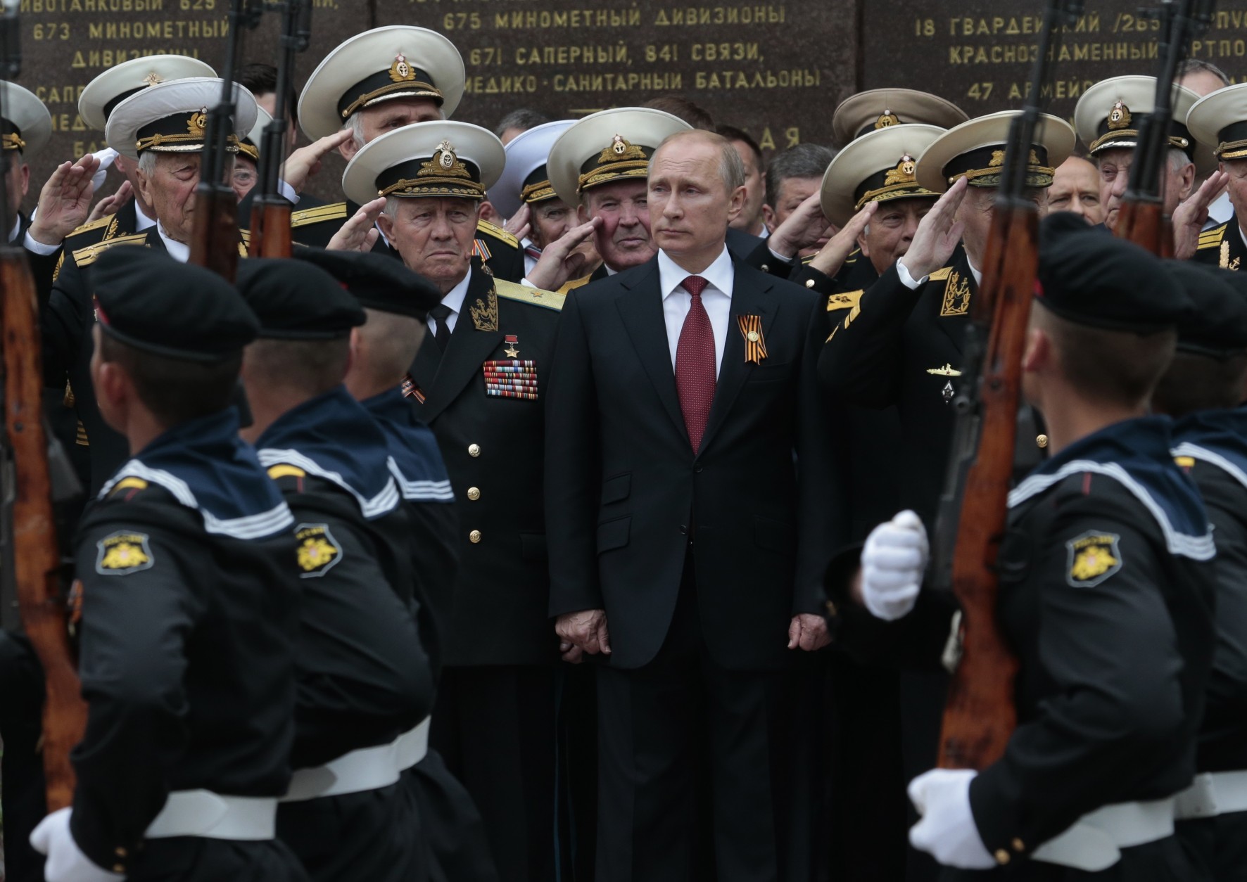 FOR USE AS DESIRED, YEAR END PHOTOS - FILE - Russian President Vladimir Putin attends a  parade marking the Victory Day in Sevastopol, Crimea, Friday, May 9, 2014. Putin extolled the return of Crimea to Russia before tens of thousands during his first trip to Black Sea peninsula since its annexation. The triumphant visit was quickly condemned by Ukraine and NATO.  (AP Photo / Ivan Sekretarev, File)