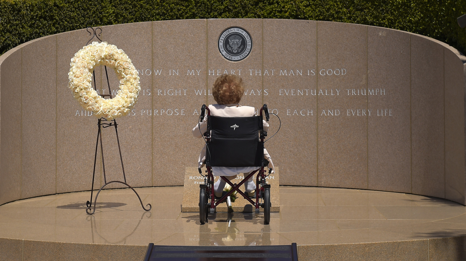 FOR USE AS DESIRED, YEAR END PHOTOS - FILE - Former first lady Nancy Reagan visits the grave site of her husband, President Ronald Reagan, at the Ronald Reagan Presidential Library, Thursday, June 5, 2014, in Simi Valley, Calif. (AP Photo/Mark J. Terrill, File)
