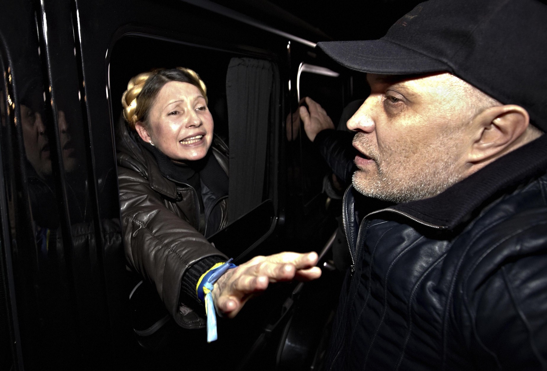 FOR USE AS DESIRED, YEAR END PHOTOS - FILE - Former Ukrainian Prime Minister Yulia Tymoshenko is greeted by supporters shortly after being freed from prison in Kharkiv, Ukraine, Saturday, Feb. 22, 2014. (AP Photo/Sergey Kozlov, File)