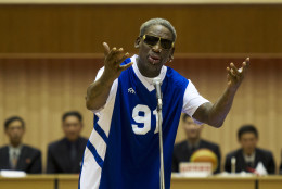 FOR USE AS DESIRED, YEAR END PHOTOS - FILE - Dennis Rodman sings Happy Birthday to North Korean leader Kim Jong Un, seated above in the stands, before an exhibition basketball game at an indoor stadium in Pyongyang, North Korea on Wednesday, Jan. 8, 2014. (AP Photo/Kim Kwang Hyon, File)