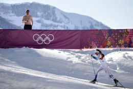 FOR USE AS DESIRED, YEAR END PHOTOS - FILE - A shirtless spectator watches Sweden's Charlotte Kalla compete during the women's 10K classical style cross-country race at the 2014 Winter Olympics, Thursday, Feb. 13, 2014, in Krasnaya Polyana, Russia. Kalla won the silver medal. (AP Photo/Jae C. Hong, File)