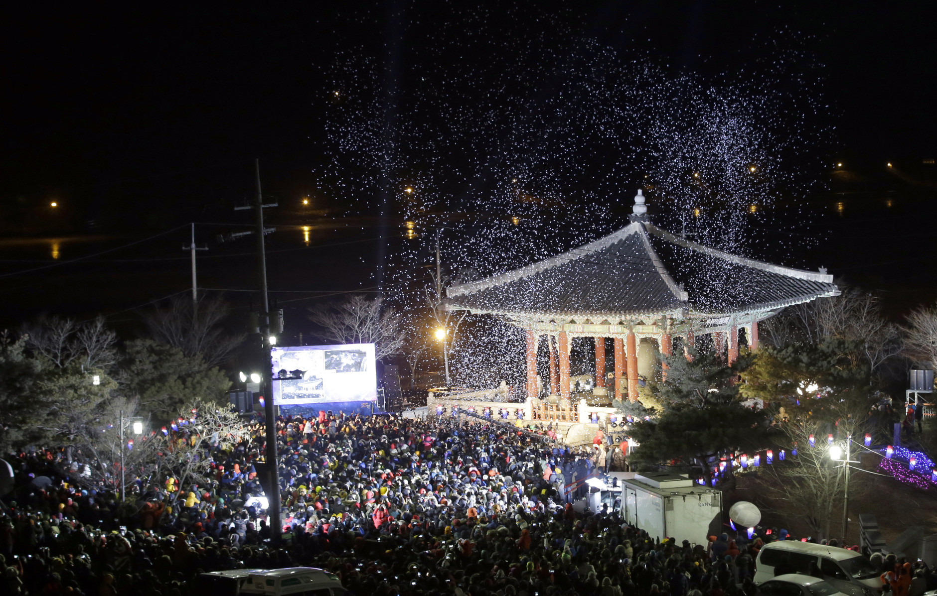 People gather to celebrate the New Year at the Imjingak Pavilion near the border village of Panmunjom, which has separated the two Koreas since the Korean War, in Paju, north of Seoul, South Korea, Thursday, Jan. 1, 2015. (AP Photo/Lee Jin-man)