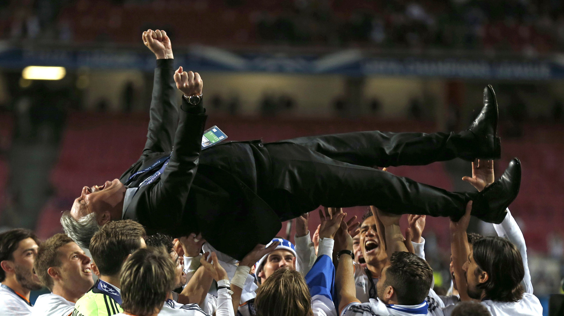 FOR USE AS DESIRED, YEAR END PHOTOS - FILE - Real's coach Carlo Ancelotti, is lifted in the air, after his team won the Champions League final soccer match between Atletico Madrid and Real Madrid in Lisbon, Portugal, Saturday, May 24, 2014.  (AP Photo/Andres Kudacki, File)