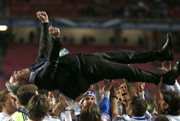 FOR USE AS DESIRED, YEAR END PHOTOS - FILE - Real's coach Carlo Ancelotti, is lifted in the air, after his team won the Champions League final soccer match between Atletico Madrid and Real Madrid in Lisbon, Portugal, Saturday, May 24, 2014.  (AP Photo/Andres Kudacki, File)