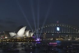 The Sydney Opera House and the Harbour Bridge are seen during New Years Eve celebrations in Sydney, Australia, Wednesday, Dec. 31, 2014. Thousands of people crammed into Lady Macquaries Chair to watch the annual fireworks show. (AP Photo/Rob Griffith)