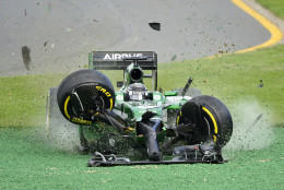 FOR USE AS DESIRED, YEAR END PHOTOS - FILE - Caterham driver Kamui Kobayashi of Japan runs off the track after he crashed with Williams driver Felipe Massa of Brazil on the first lap of the Australian Formula One Grand Prix at Albert Park in Melbourne, Australia, Sunday, March 16, 2014. Both Massa and Kobayashi walked away from the accident. (AP Photo/Ross Land, File)