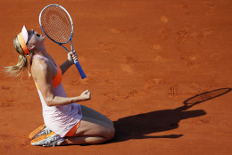 FOR USE AS DESIRED, YEAR END PHOTOS - FILE - Russia's Maria Sharapova reacts after defeating Romania's Simona Halep during their final match of the French Open tennis tournament at the Roland Garros stadium, in Paris, France, Saturday, June 7, 2014. Sharapova won 6-4, 6-7, 6-4. (AP Photo/David Vincent, File)