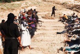 FOR USE AS DESIRED, YEAR END PHOTOS - FILE - This image posted on a militant website on Saturday, June 14, 2014, which has been verified and is consistent with other AP reporting, appears to show militants from the al-Qaida-inspired Islamic State of Iraq and the Levant (ISIL) taking aim at captured Iraqi soldiers wearing plain clothes after taking over a base in Tikrit, Iraq.  (AP Photo via militant website, File)