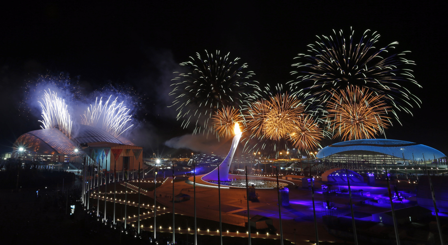FOR USE AS DESIRED, YEAR END PHOTOS - FILE - Fireworks are seen over the Olympic Park during the opening ceremony of the 2014 Winter Olympics in Sochi, Russia, Friday, Feb. 7, 2014. (AP Photo/Julio Cortez, File)