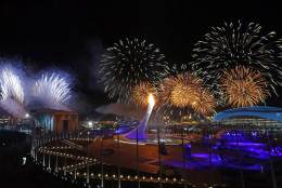 FOR USE AS DESIRED, YEAR END PHOTOS - FILE - Fireworks are seen over the Olympic Park during the opening ceremony of the 2014 Winter Olympics in Sochi, Russia, Friday, Feb. 7, 2014. (AP Photo/Julio Cortez, File)
