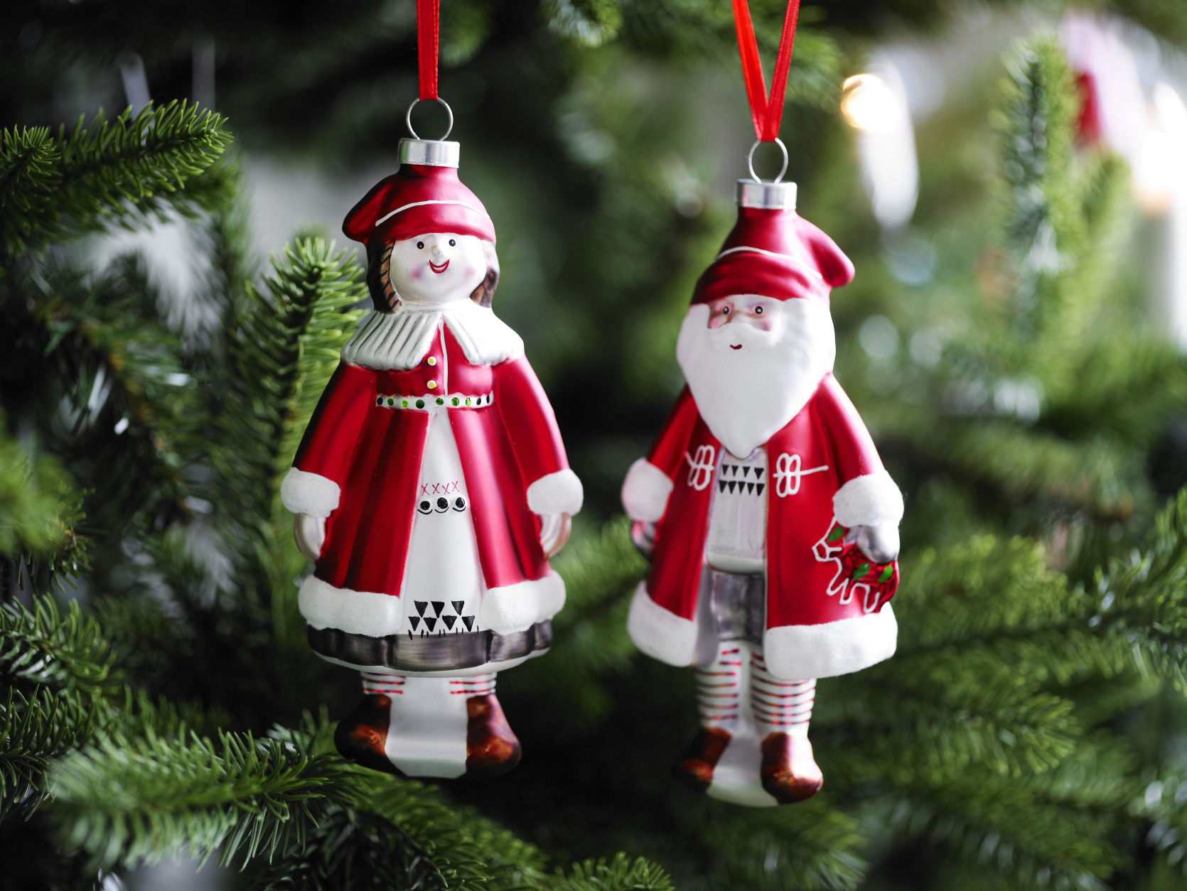 This photo provided by Ikea shows Heart and Folk Santas, folk art-y ornaments, rendered in any material, that are at the heart of a traditional Christmas. Following the general trend in home decor, holiday trim and accessories this year are a mix of eclectic and traditional colors and styles. Style watchers say were approaching the holidays with a more open mind, and decor has never been more expansive in terms of what works. (AP Photo/Ikea)