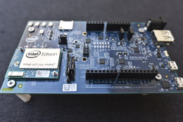 This Wednesday, Dec. 10, 2014 photo shows the Intel Edison, a small programmable computer the size of an SD memory card, seated on an electronics expansion board, in Decatur, Ga. The Edison has both Wi-Fi and Bluetooth technology built in, as well as a full distribution of the Linux operating system. (AP Photo/Ron Harris)